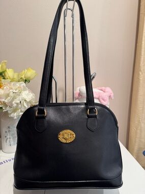 Classic Black Leather Shoulder Bag with Gold Medallion